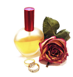perfume, rings, and a rose